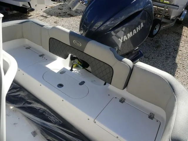 Slide: The Image of 2025 Key West 203 FS boat with Yamaha engine, rear seating area. - 13