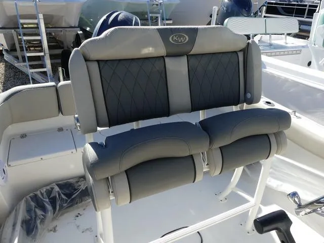 Slide: The Image of 2025 Key West 203 FS boat seating with gray cushioned backrests and armrests. - 9
