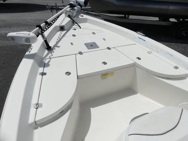 Slide: The Image of 2013 NauticStar 1910 NauticBay boat deck with storage compartments and trolling motor. - 11