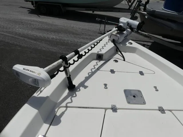 Slide: The Image of 2013 NauticStar 1910 NauticBay boat deck with trolling motor, docked on a trailer. - 12