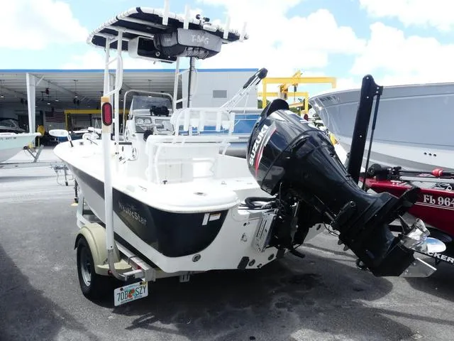 Slide: The Image of 2013 NauticStar 1910 NauticBay boat with Suzuki outboard motor on trailer. - 3