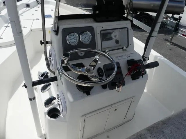 Slide: The Image of 2013 NauticStar 1910 NauticBay boat console with steering wheel and gauges. - 6