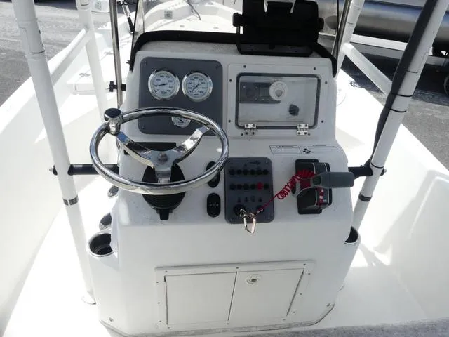 Slide: The Image of 2013 NauticStar 1910 NauticBay boat console with steering wheel and control panel. - 7