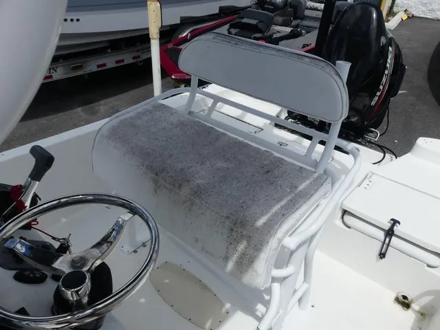 Slide: The Image of 2013 NauticStar 1910 NauticBay boat interior with steering wheel and seating. - 8