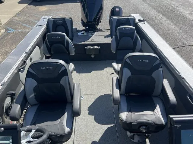 Slide: The Image of 2023 Lund 1975 Tyee Sport boat interior with four cushioned seats. - 16