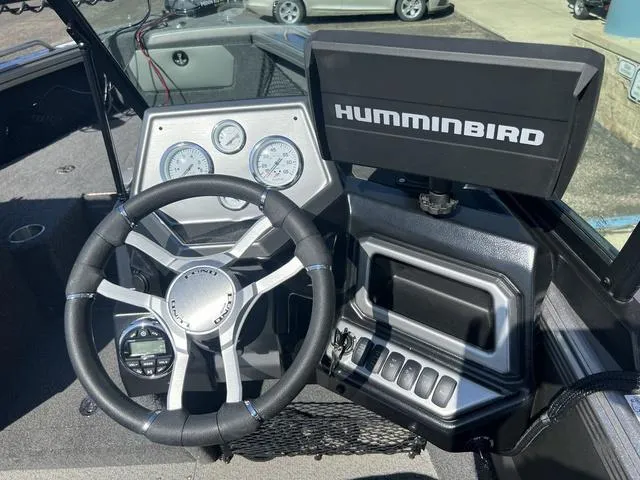 Slide: The Image of Cockpit of 2023 Lund 1975 Tyee Sport with steering wheel and Humminbird display. - 20