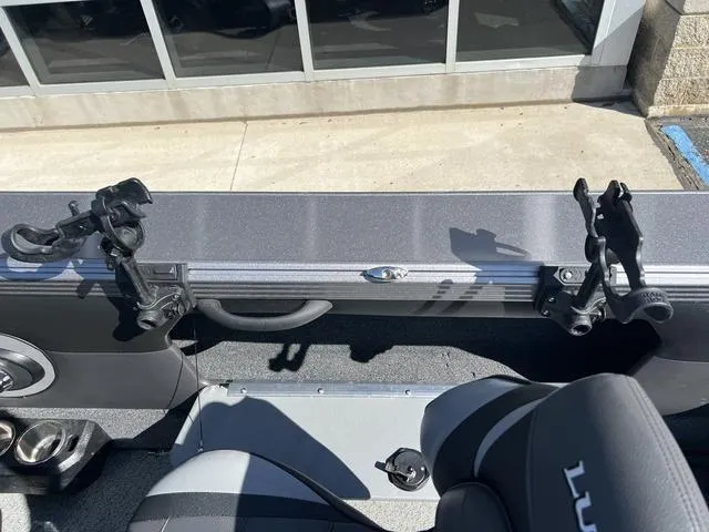 Slide: The Image of Interior of 2023 Lund 1975 Tyee Sport boat with rod holders and seating. - 22