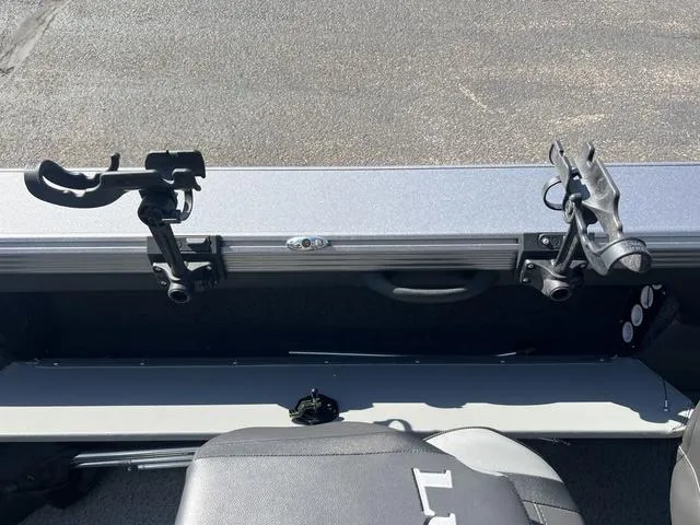 Slide: The Image of Fishing rod holders on a 2023 Lund 1975 Tyee Sport boat, interior view. - 23
