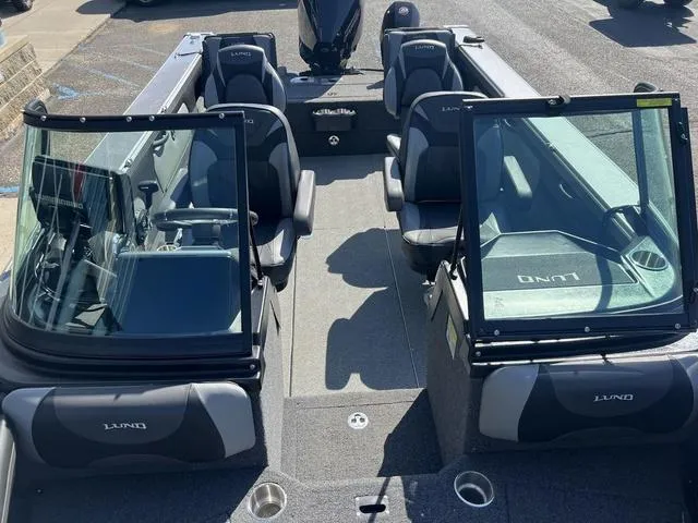 Slide: The Image of 2023 Lund 1975 Tyee Sport boat interior with seating and windshield. - 31