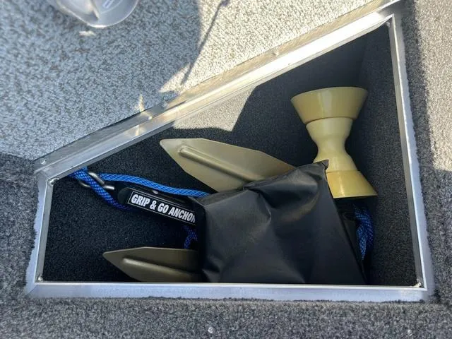 Slide: The Image of Anchor storage in 2023 Lund 1975 Tyee Sport boat compartment. - 32