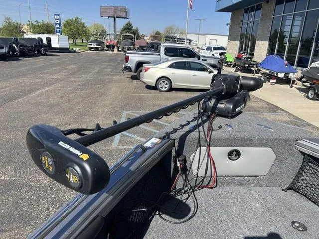 Slide: The Image of 2023 Lund 1975 Tyee Sport boat with trolling motor in parking lot. - 35
