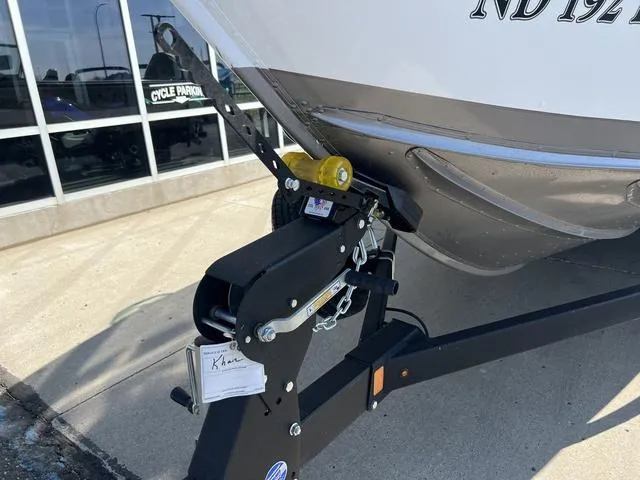 Slide: The Image of 2023 Lund 1975 Tyee Sport boat trailer hitch detail in outdoor setting. - 5