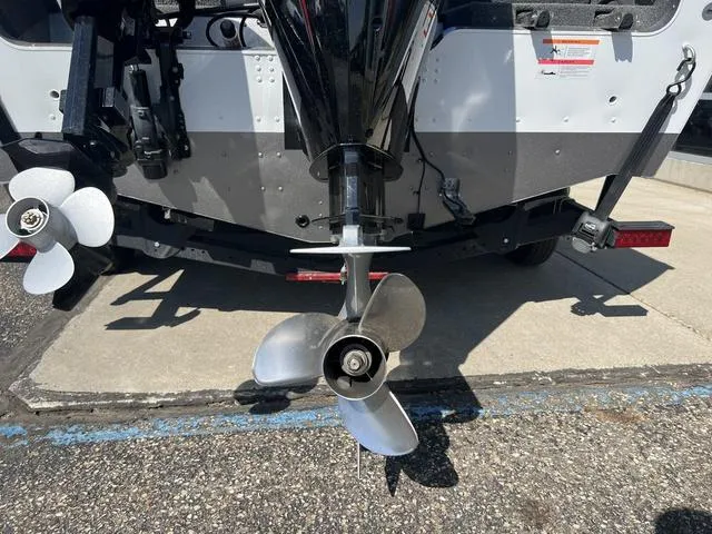 Slide: The Image of Propeller of 2023 Lund 1975 Tyee Sport boat on pavement. - 8