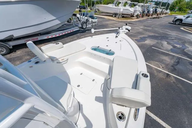 Slide: The Image of 2025 Sea Pro 250 Bay boat with seating and fishing equipment on display. - 23