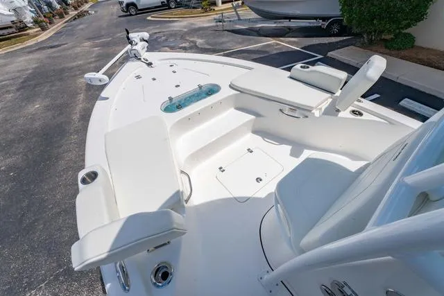 Slide: The Image of 2025 Sea Pro 250 Bay boat interior with seating and storage compartments. - 24