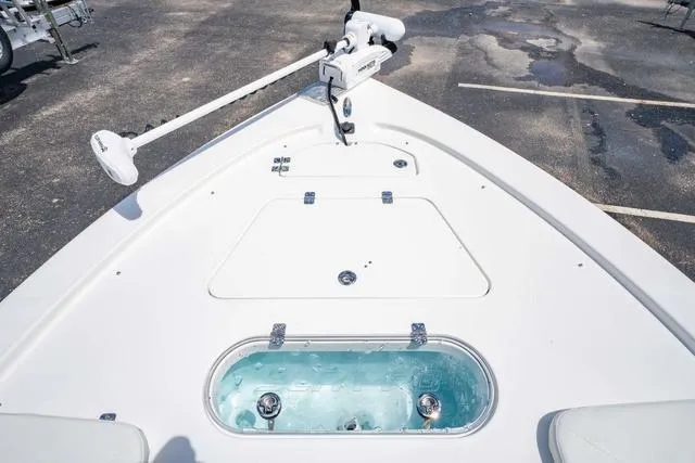 Slide: The Image of 2025 Sea Pro 250 Bay boat deck with livewell and trolling motor. - 25