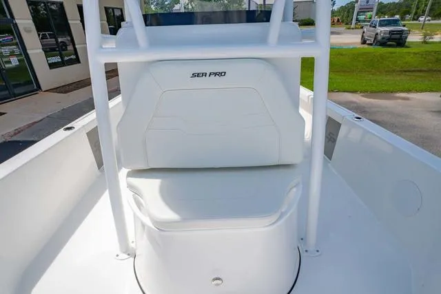 Slide: The Image of 2025 Sea Pro 250 Bay boat interior with white seating and console. - 29