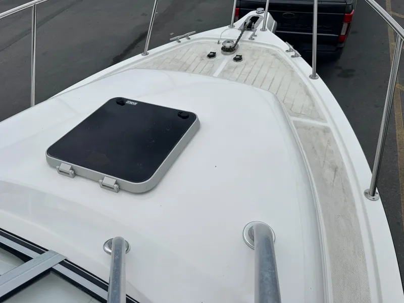 Slide: The Image of 2008 Century 2600 Walkaround boat deck with hatch and railing. - 15