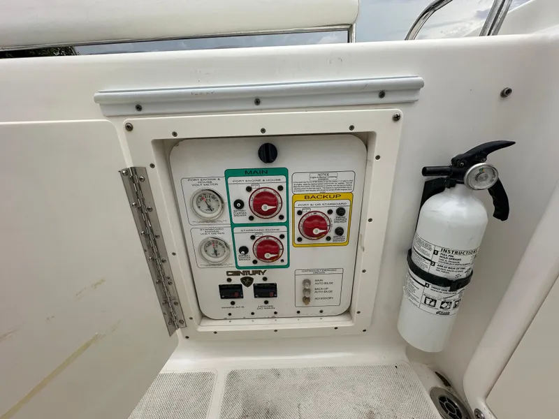 Slide: The Image of Control panel of a 2008 Century 2600 Walkaround boat with fire extinguisher. - 16