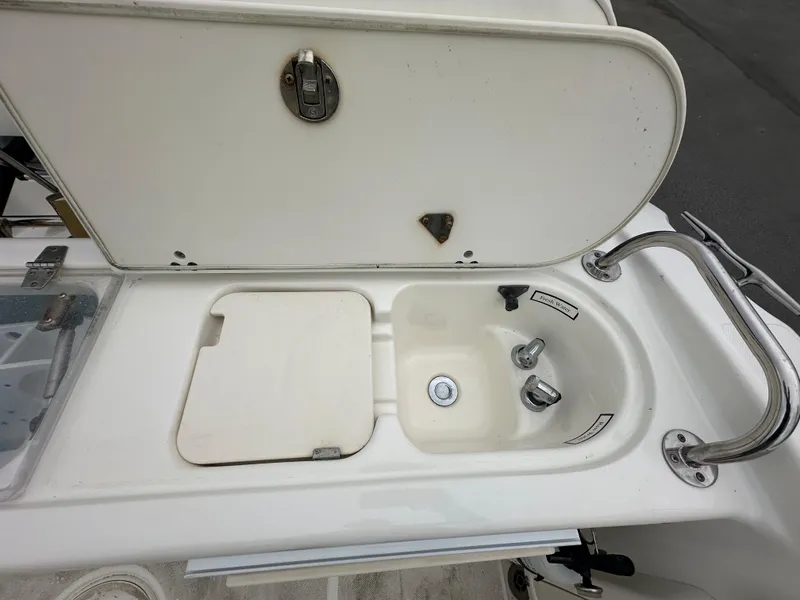 Slide: The Image of 2008 Century 2600 Walkaround boat sink and cutting board setup. - 17