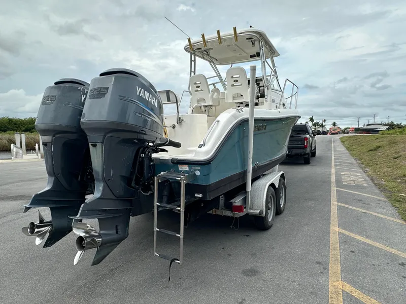 Slide: The Image of 2008 Century 2600 Walkaround boat with twin Yamaha engines on a trailer. - 5