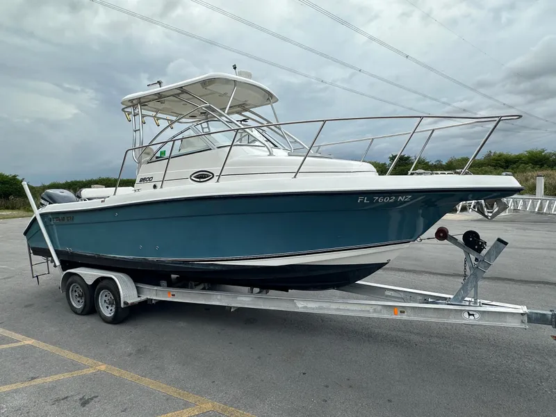 Slide: The Image of 2008 Century 2600 Walkaround boat on trailer, parked outdoors. - 7