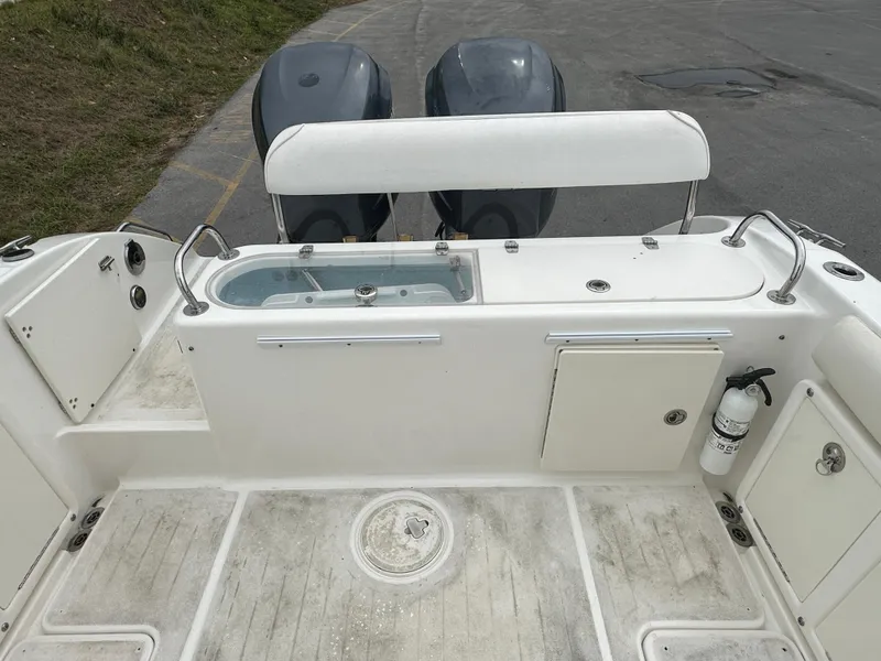 Slide: The Image of 2008 Century 2600 Walkaround boat deck with dual engines and storage compartments. - 9