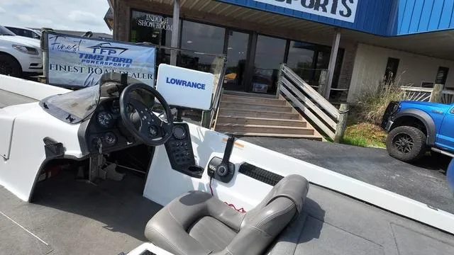 Slide: The Image of 1997 Pro Craft 200 Super Pro boat interior with steering wheel and Lowrance equipment. - 11