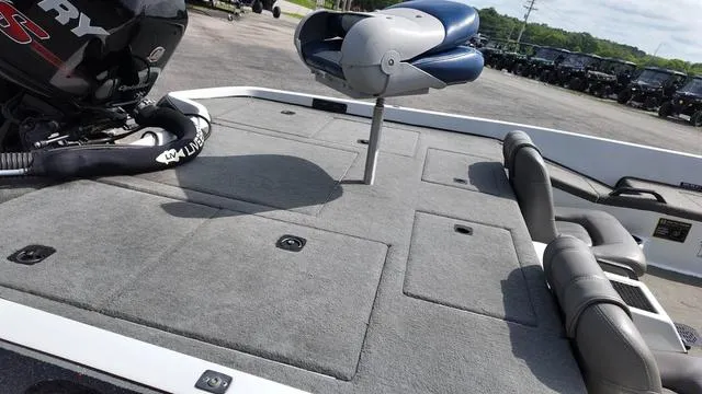 Slide: The Image of 1997 Pro Craft 200 Super Pro boat with seating and storage compartments. - 13