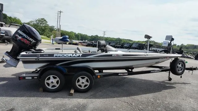 Slide: The Image of 1997 Pro Craft 200 Super Pro boat on trailer, featuring Mercury outboard motor. - 6