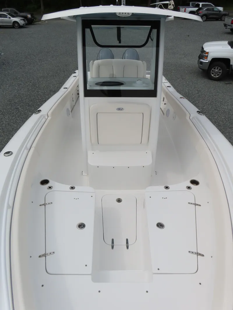 Slide: The Image of 2023 Sea Hunt Gamefish 25 boat with spacious deck and center console. - 17