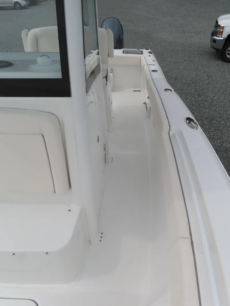 Slide: The Image of 2023 Sea Hunt Gamefish 25 boat deck, featuring sleek design and spacious layout. - 19