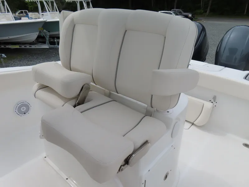 Slide: The Image of 2023 Sea Hunt Gamefish 25 boat seating with cushioned armrests and backrests. - 24
