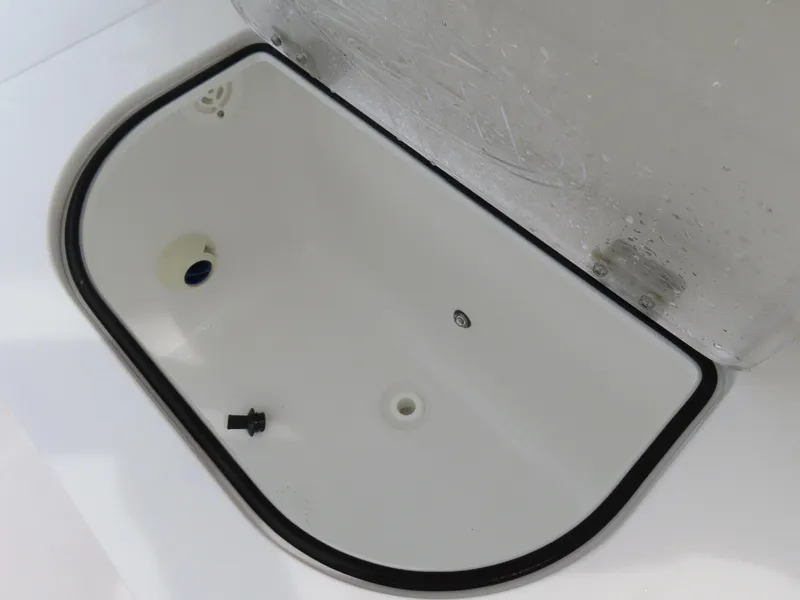 Slide: The Image of Livewell compartment of 2023 Sea Hunt Gamefish 25 boat, open and empty. - 31