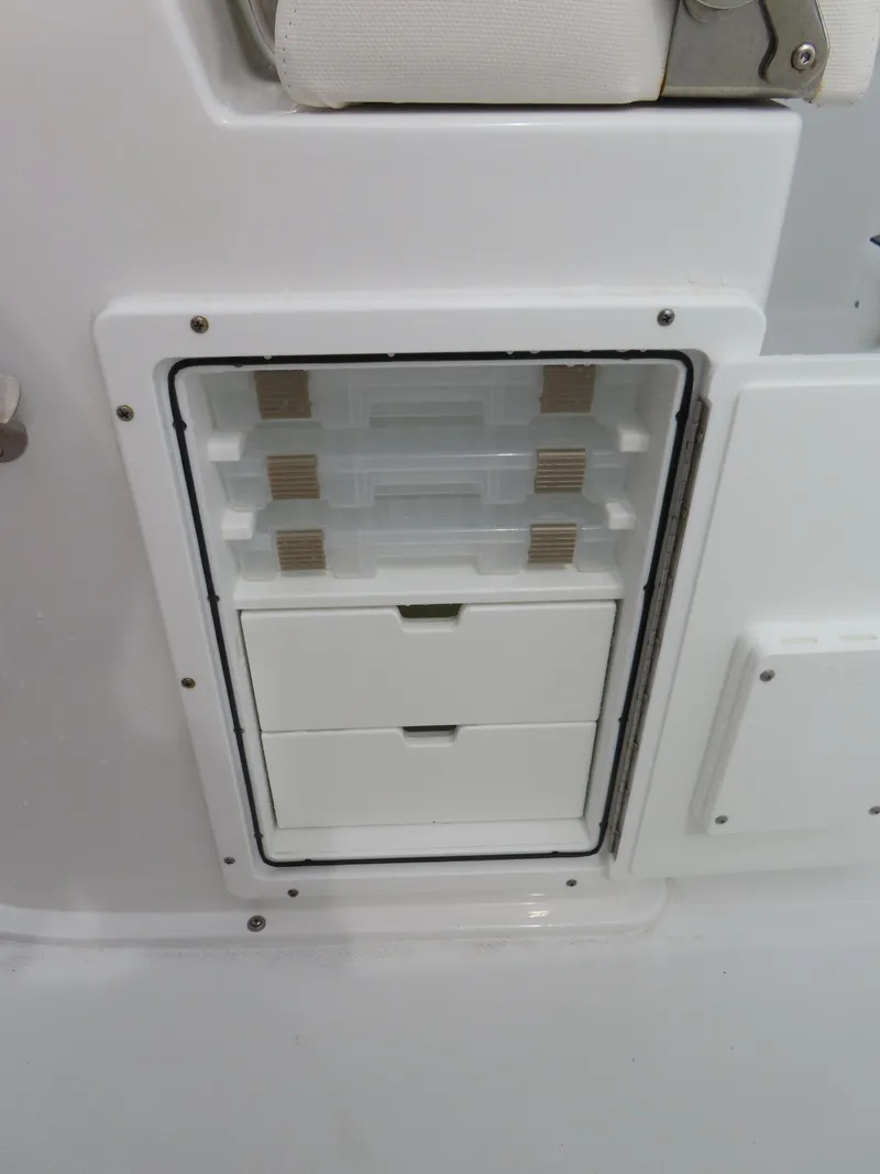 Slide: The Image of 2023 Sea Hunt Gamefish 25 storage compartment with drawers and tackle boxes. - 33