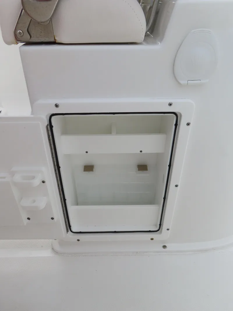 Slide: The Image of 2023 Sea Hunt Gamefish 25 boat storage compartment, white interior, close-up view. - 35