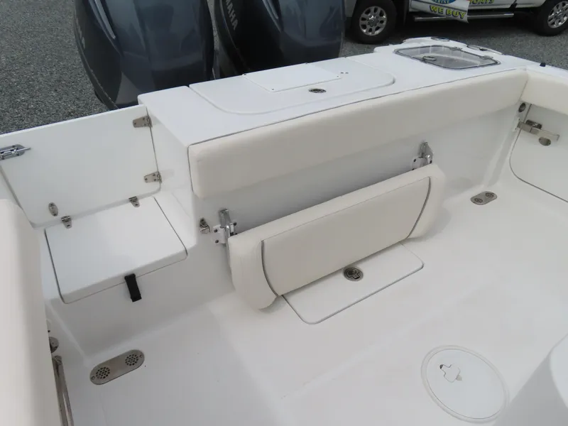 Slide: The Image of 2023 Sea Hunt Gamefish 25 boat interior with seating and storage compartments. - 37