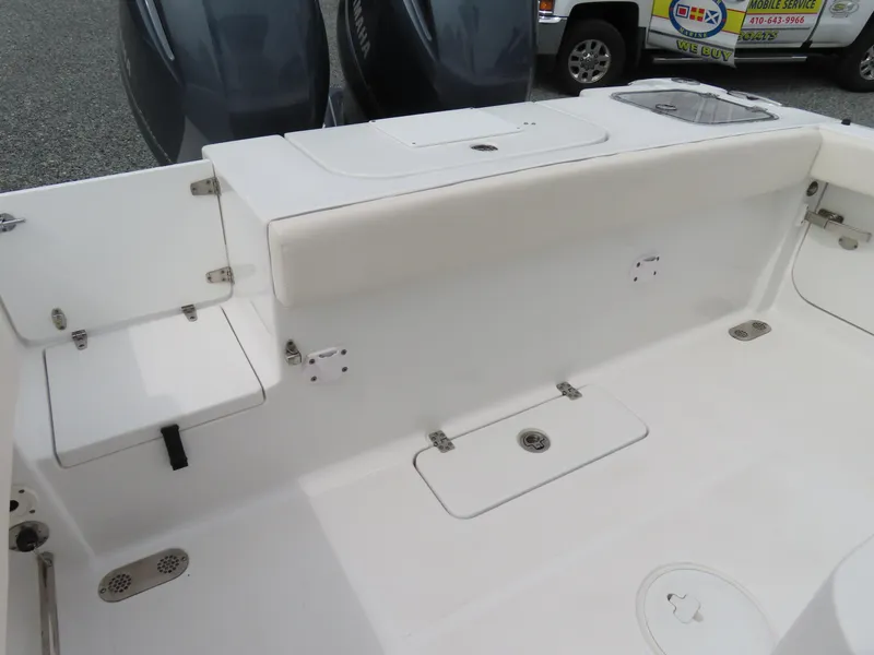 Slide: The Image of 2023 Sea Hunt Gamefish 25 boat interior with seating and storage compartments. - 38