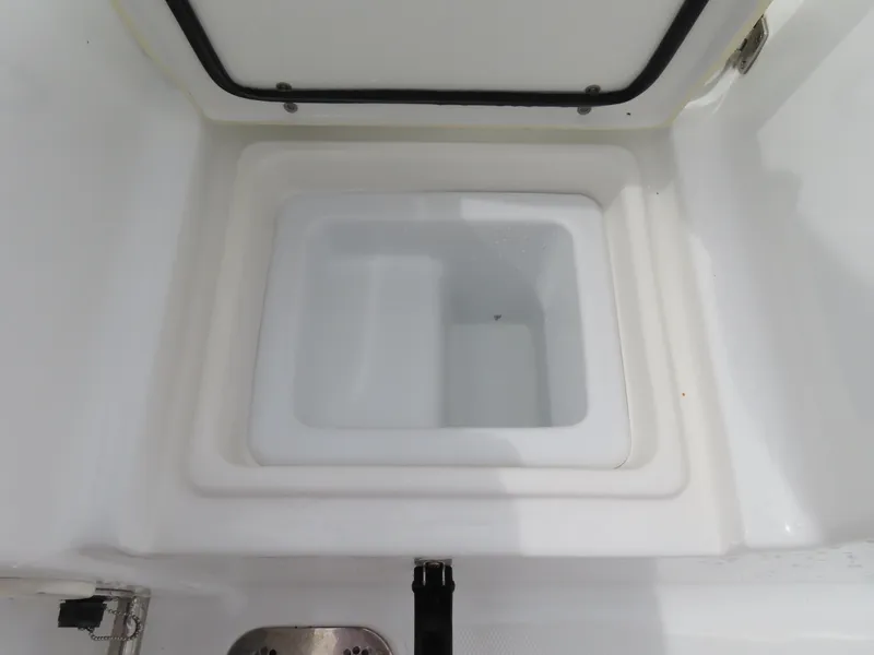 Slide: The Image of Open storage compartment on 2023 Sea Hunt Gamefish 25 boat. - 40