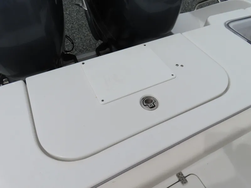 Slide: The Image of 2023 Sea Hunt Gamefish 25 boat deck with dual engines and storage compartment. - 41