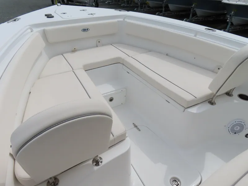 Slide: The Image of 2023 Sea Hunt Gamefish 25 boat interior with white cushioned seating. - 7