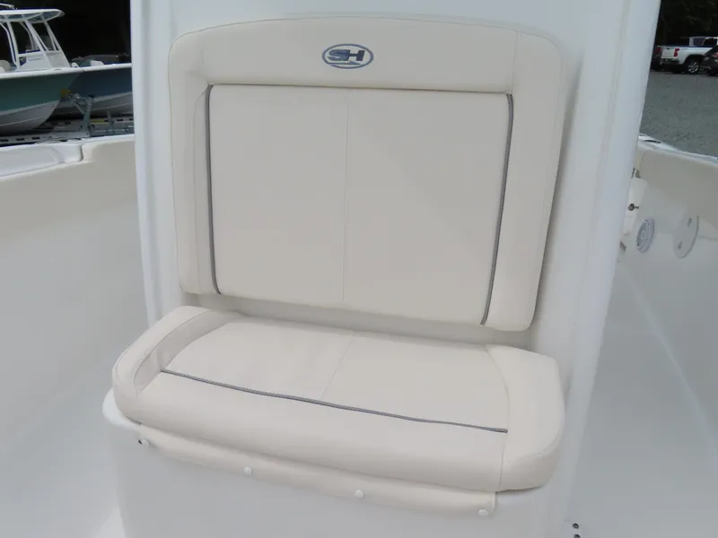 Slide: The Image of 2023 Sea Hunt Gamefish 25 boat seat, white cushioned backrest and seat. - 8