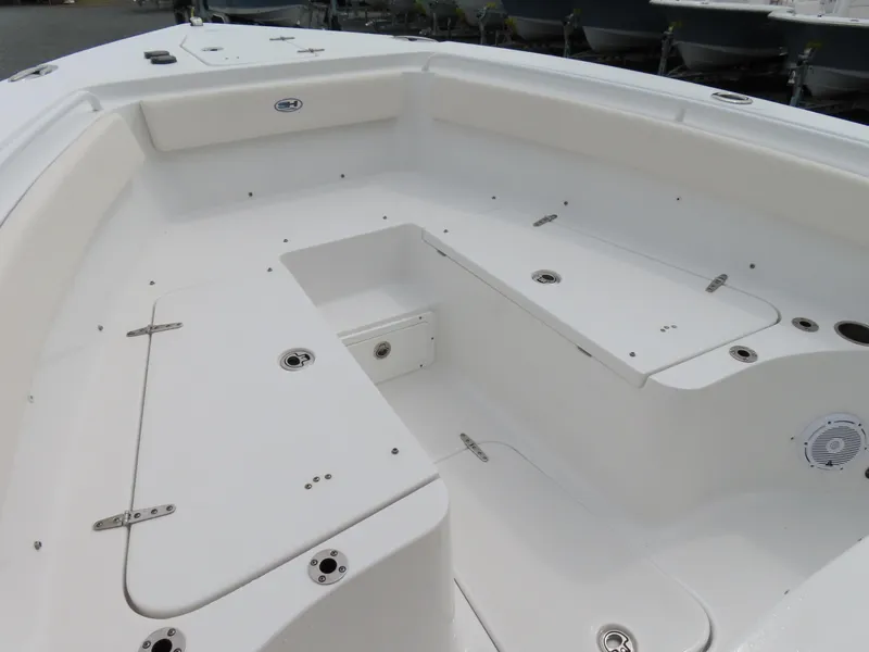 Slide: The Image of 2023 Sea Hunt Gamefish 25 boat interior with spacious seating and storage compartments. - 9