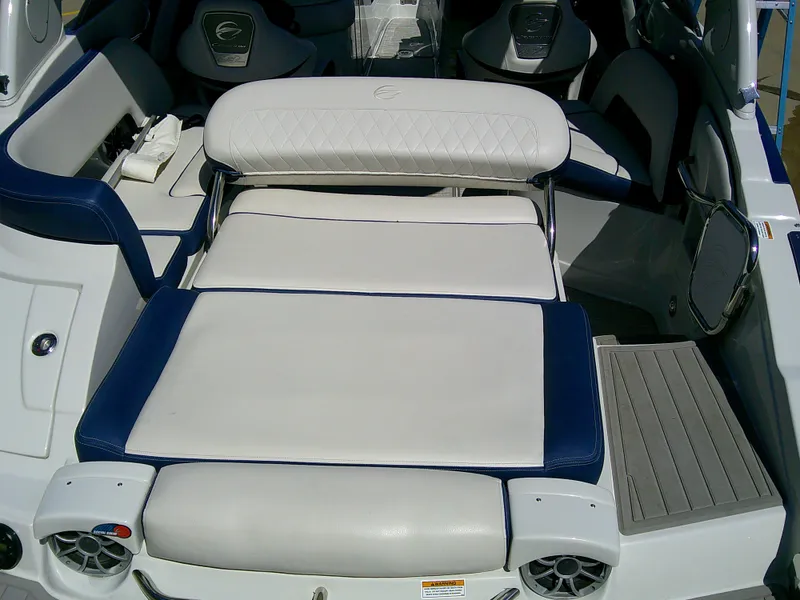 Slide: The Image of 2021 Crownline 255 SS boat interior with white and blue seating. - 10