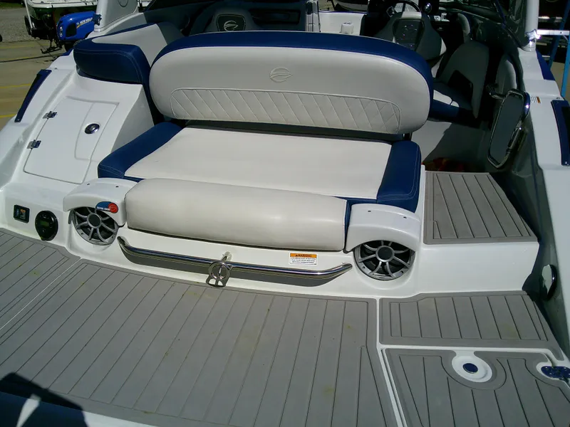Slide: The Image of 2021 Crownline 255 SS boat interior with cushioned seating and modern design. - 12