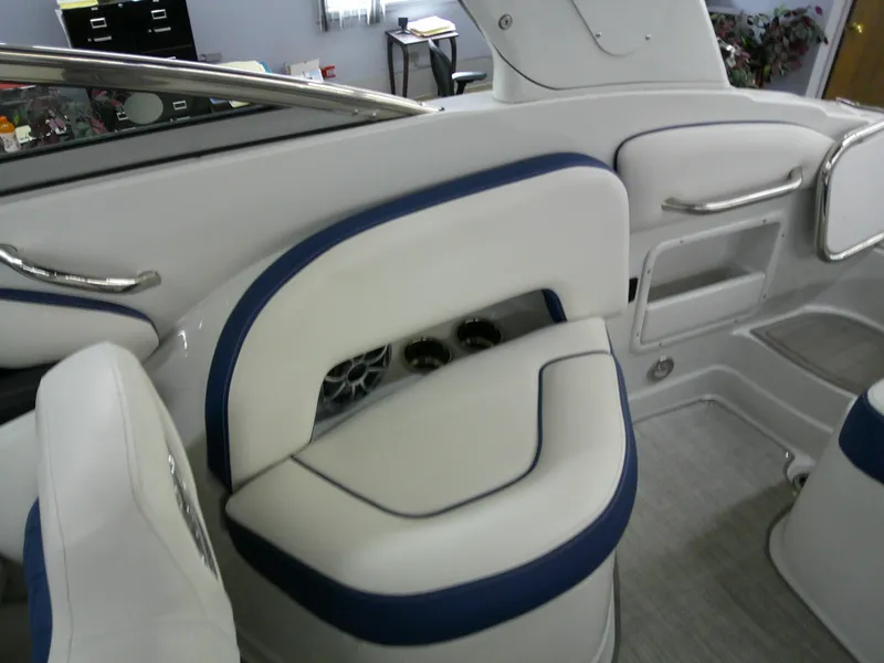 Slide: The Image of Interior of 2021 Crownline 255 SS boat with white and blue seating. - 14