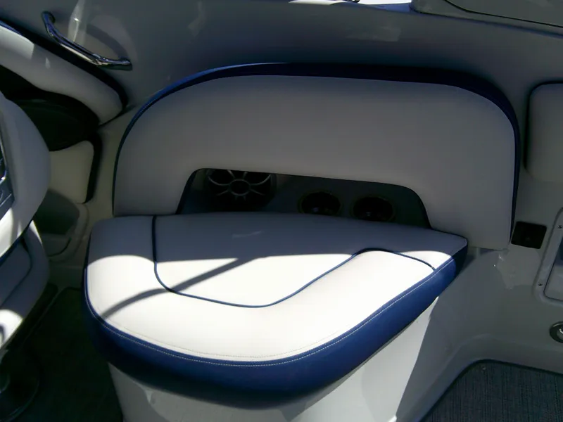Slide: The Image of 2021 Crownline 255 SS boat interior with cushioned seating and speaker system. - 18