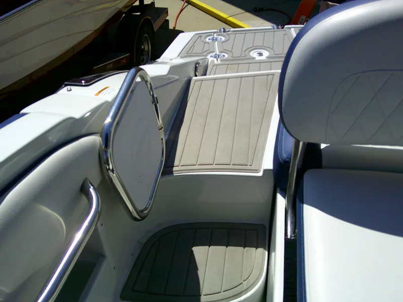 Slide: The Image of 2021 Crownline 255 SS boat interior with seating and deck details. - 19