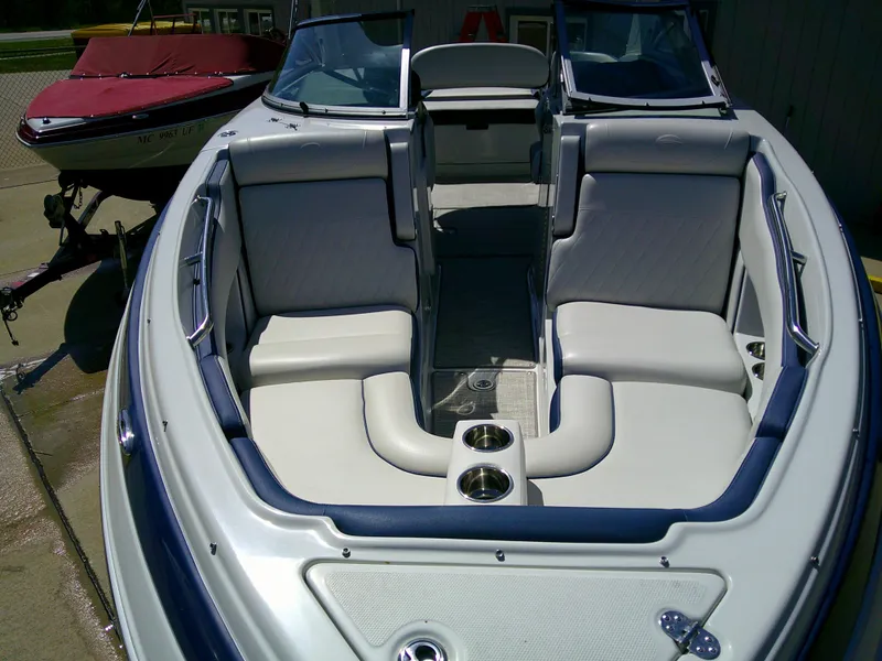 Slide: The Image of 2021 Crownline 255 SS boat interior with spacious seating and cup holders. - 3