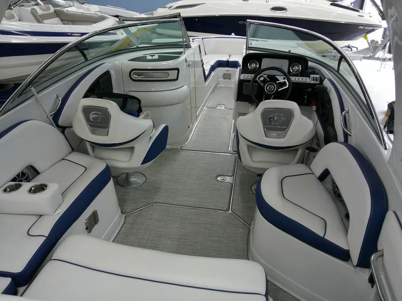 Slide: The Image of 2021 Crownline 255 SS boat interior with luxurious seating and modern dashboard. - 4